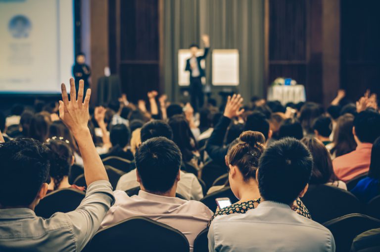 Speaker On the Stage With Audience