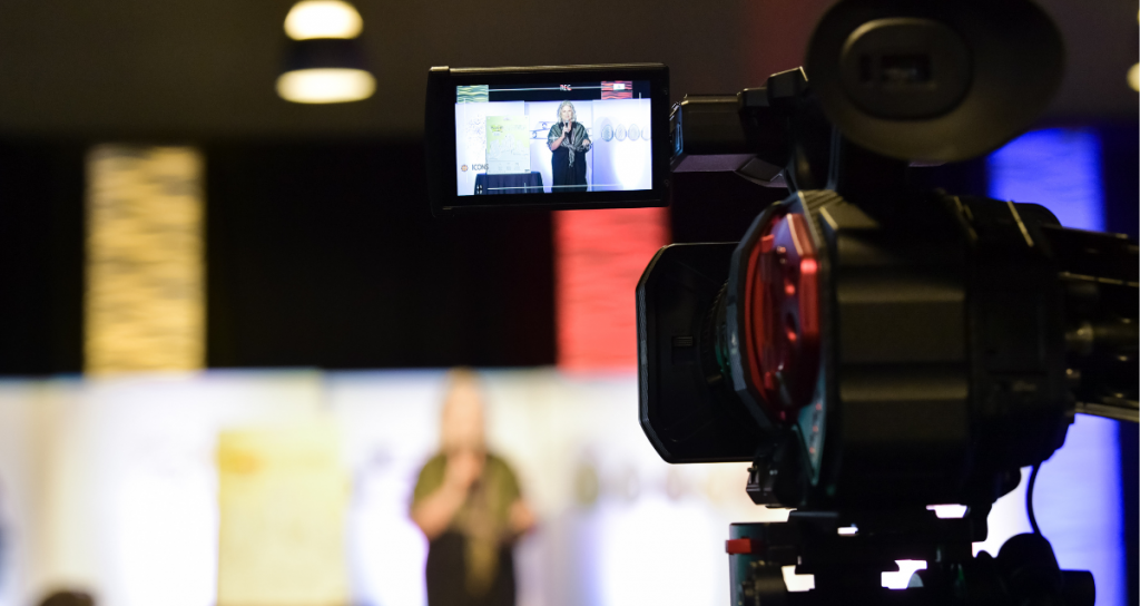 Camera Recording live presenter for a hybrid event managed by Miller Tanner Associates.